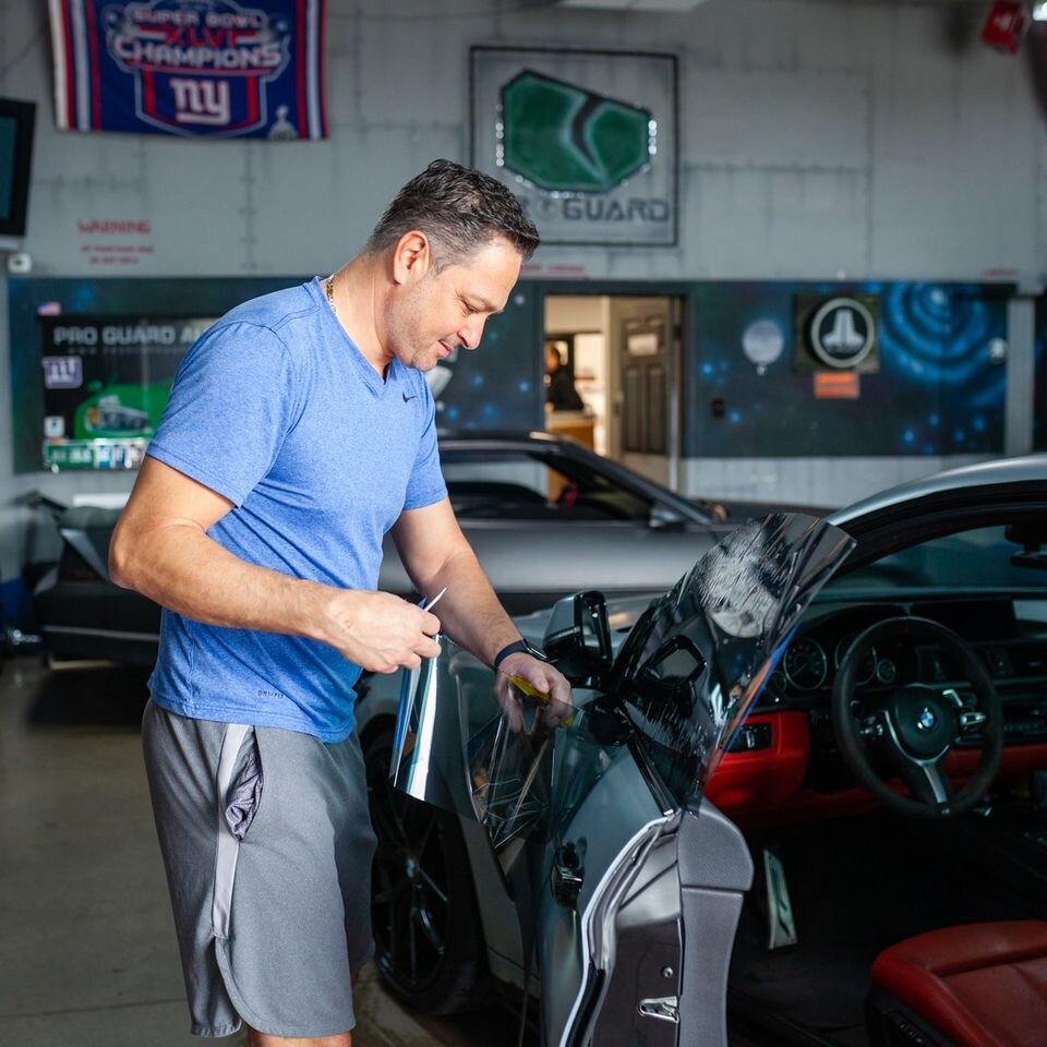 Jon installing window tint