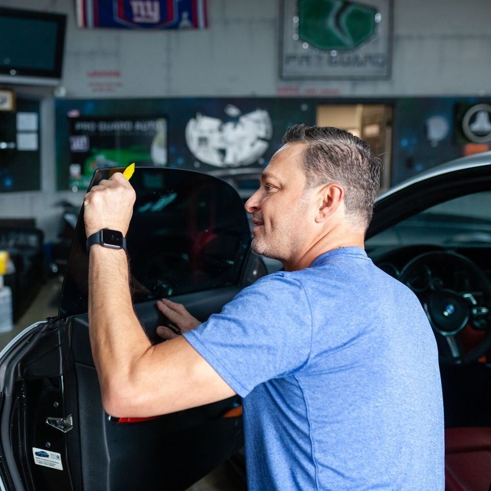 Jon finishing a tint install